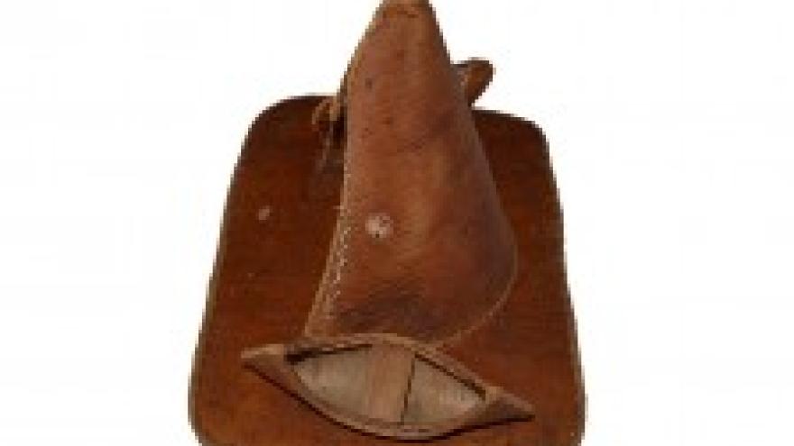 Traditional leather teepee and canoes.