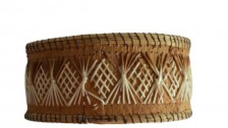 Woven basket with geometric pattern, brown and beige tones.