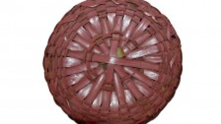 Woven wicker ball with red-brown strips.