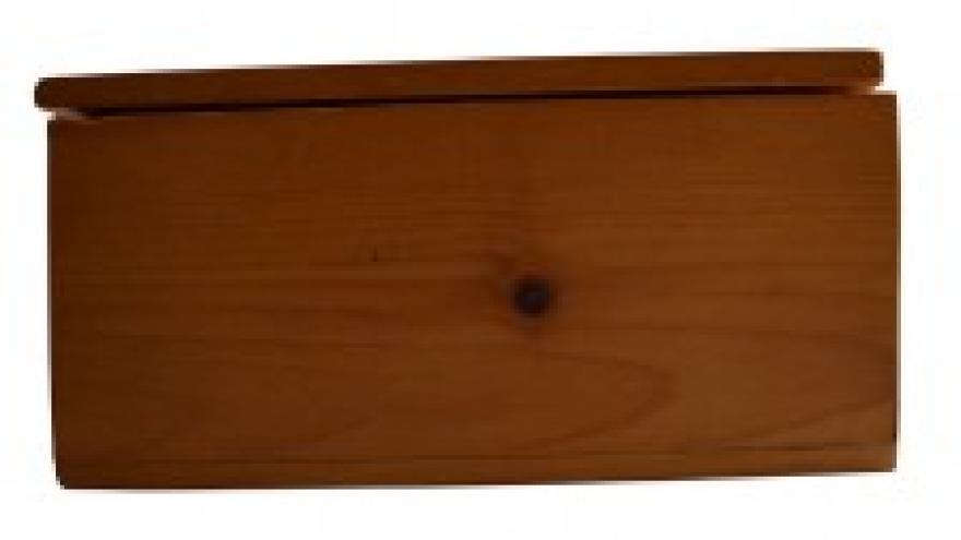 Wooden box with a closed hinged lid.