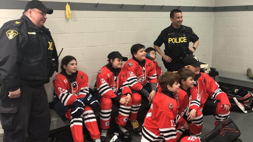 Fire-Fighter-with-hockey-team